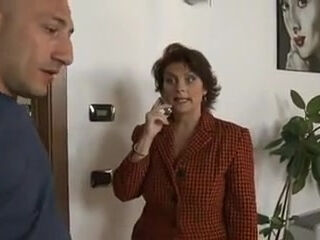 Mature woman pays the repairman.